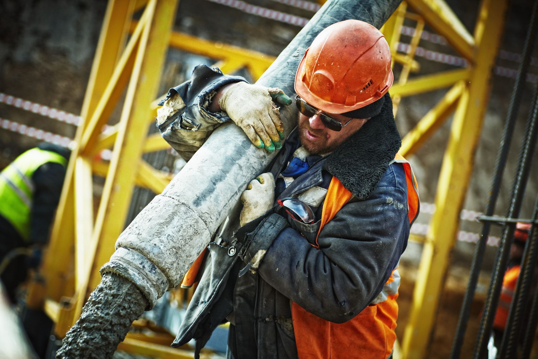Concrete being placed through a pump hose on a construction site